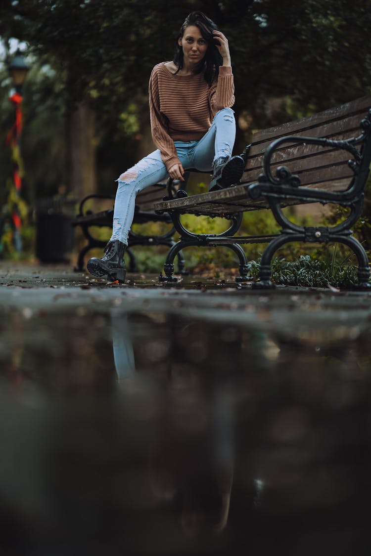 Girl Sitting On Bench In Park