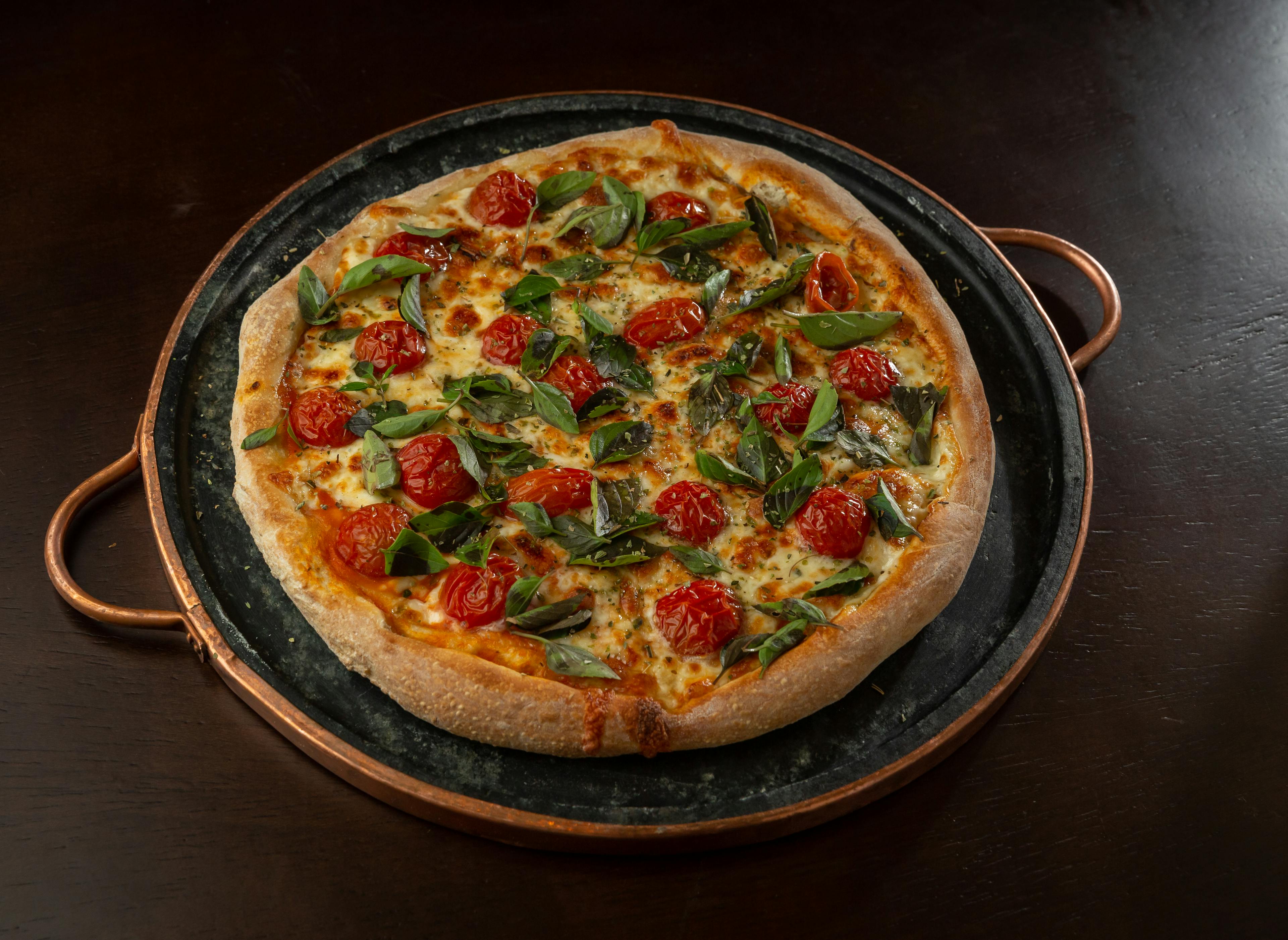 Pizza on Brown Wooden Round Tray