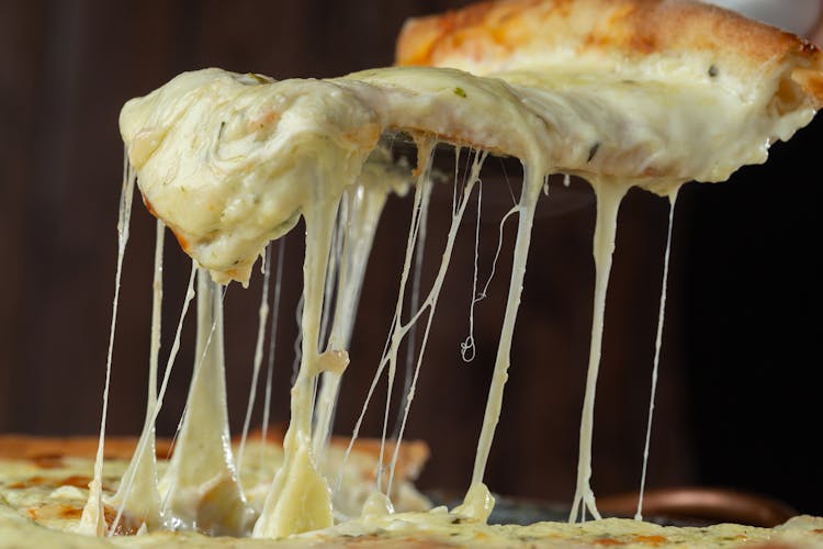 A Close-Up Shot Of A Delicious Cheese Pizza