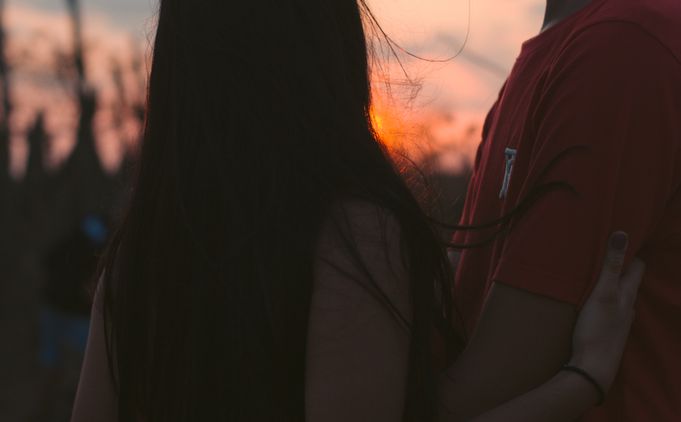 latina couple smiling happily together