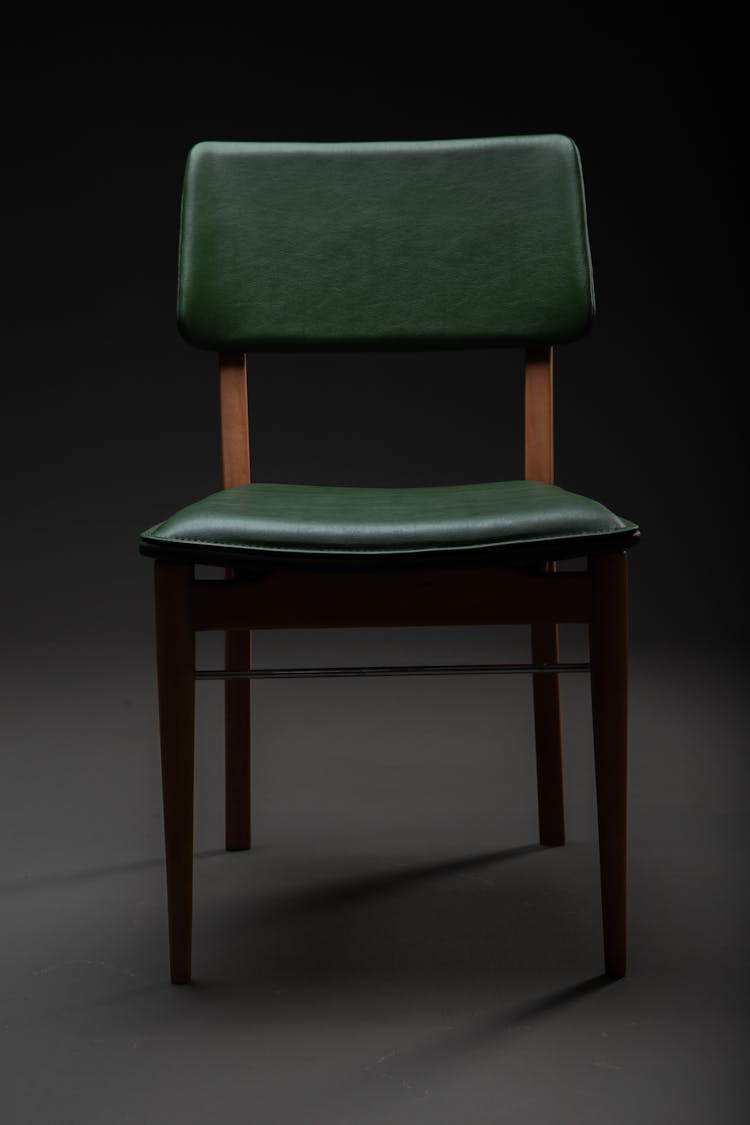 Empty Chair In Black Room