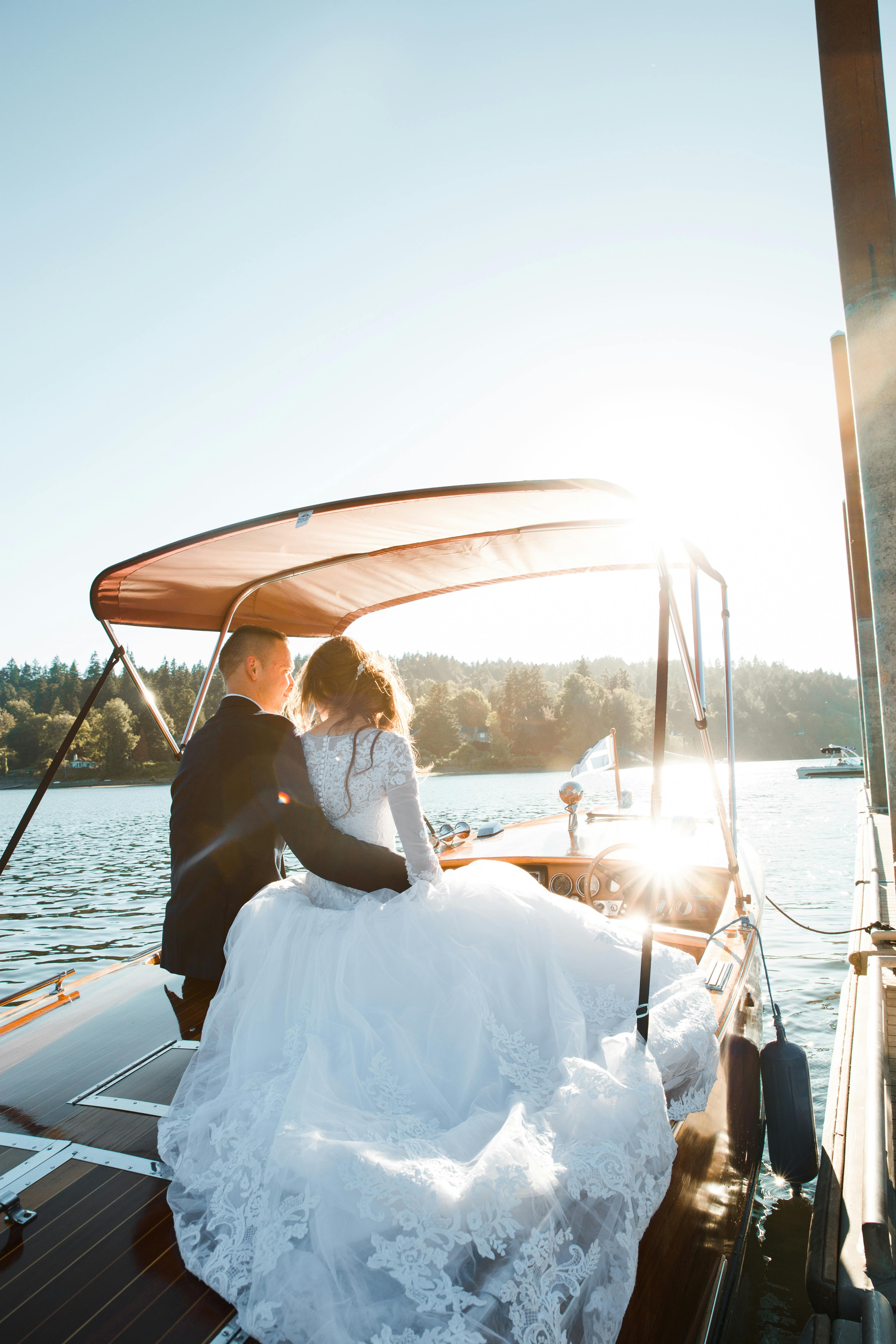 man hugging woman on yacht