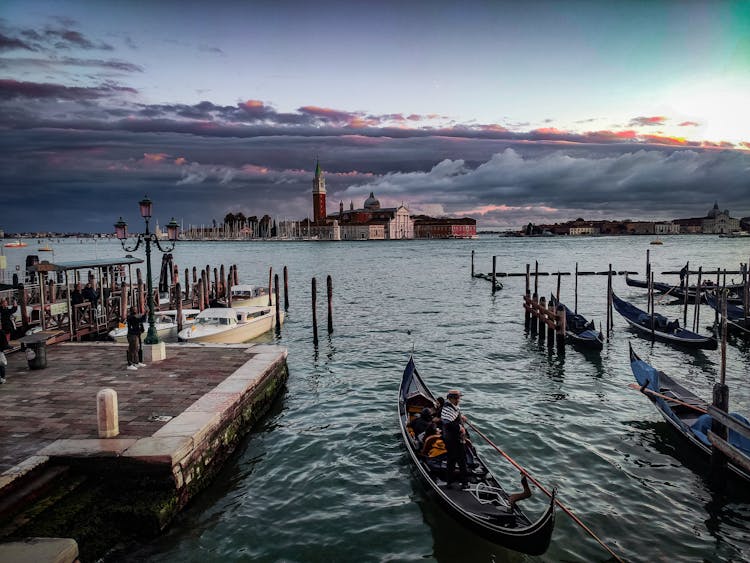 A Man Paddling A Gondola