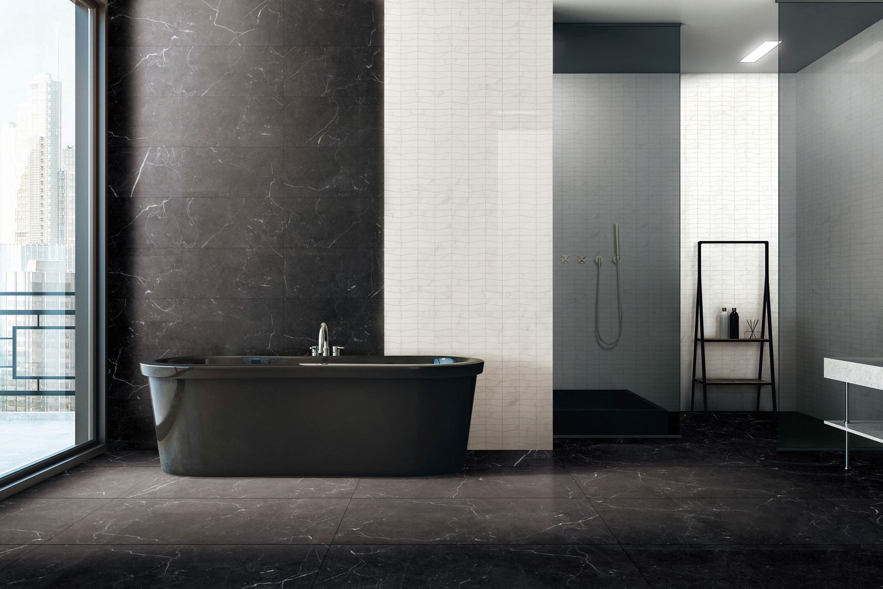 Black freestanding bathtub in a black and white bathroom