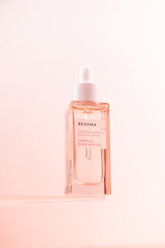 Elegant minimalist photo of camellia glow face oil with soft lighting.
