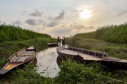 Boats on Canal between Rural Fields