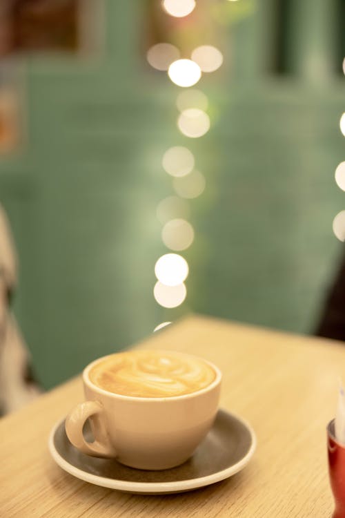 A White Ceramic Cup with Foamy Drink 