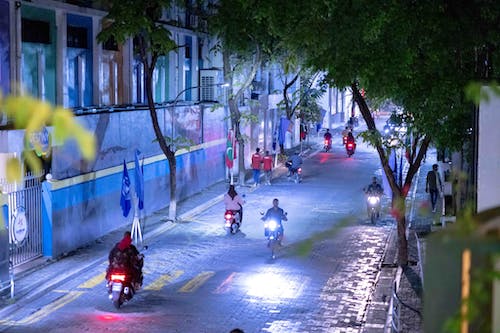 Photo of People Riding Motorcycles on a Road