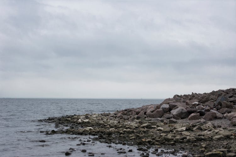 Rocks Piling On Sea Shore