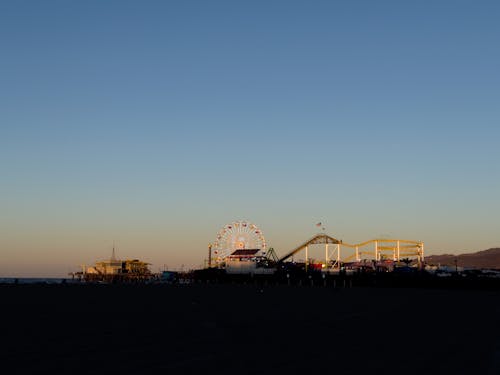 Amusement Park on Beach in Shadow at Sunset
