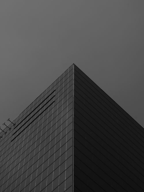 Free Low angle black and white photo of a modern building corner in Mexico City, CDMX, Mexico. Stock Photo