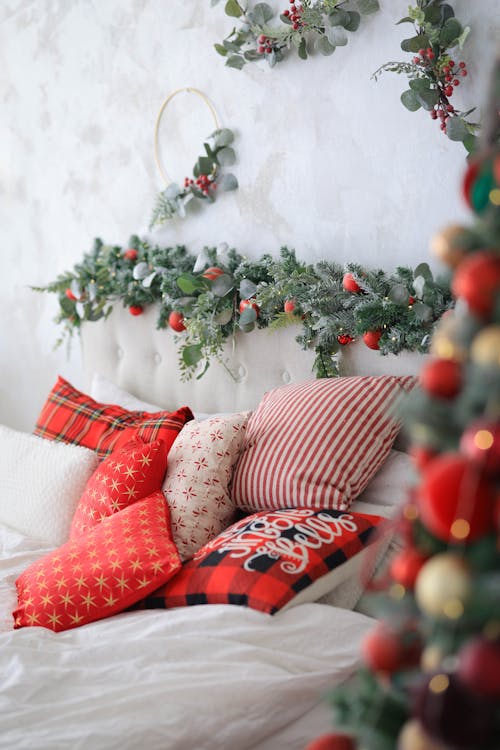 Pillows on a Bed with Christmas Decorations