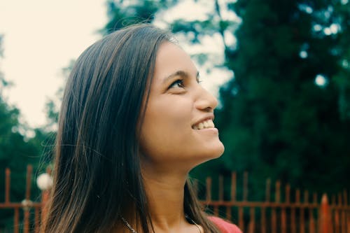 Free Side Profile of a Woman Smiling Stock Photo