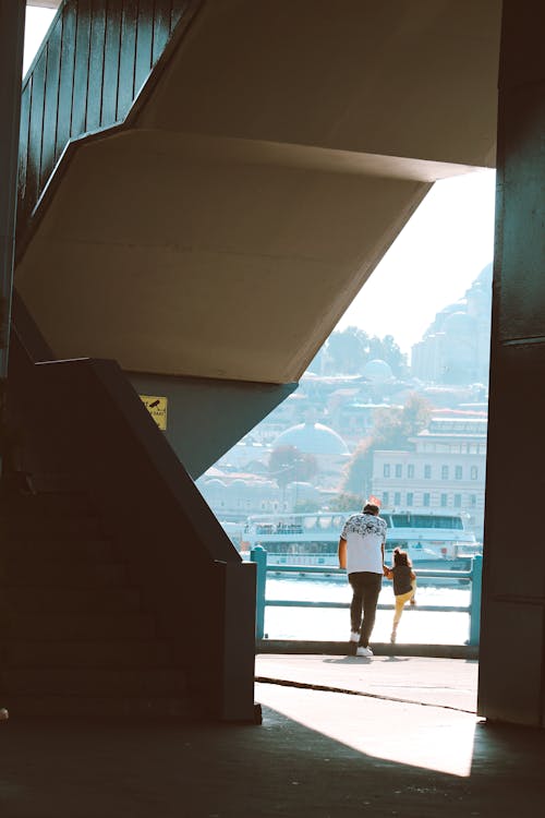 Man and Girl Looking at City