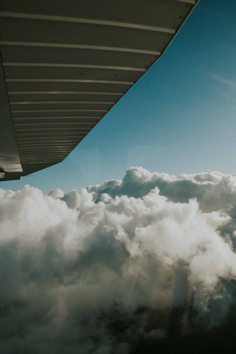 Clouds Below An Airplane Wing