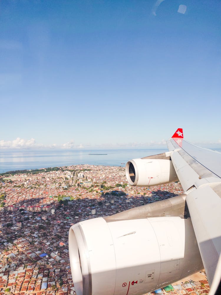 Airplane Wing Over City