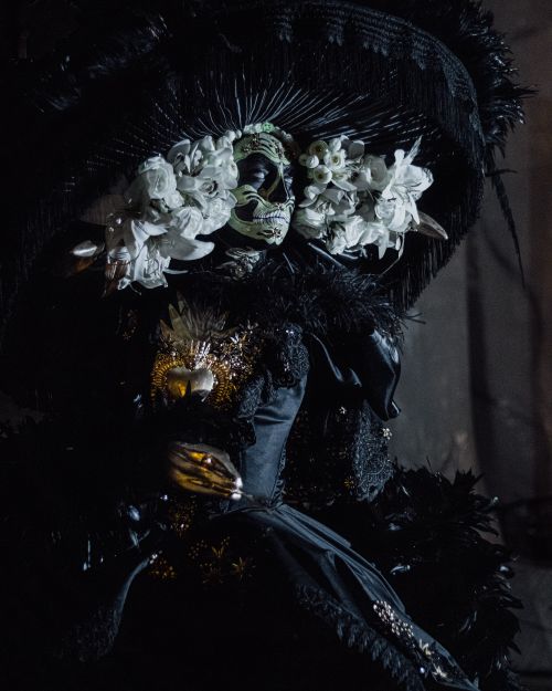 Mexican girl dressed as a catrina with a black suit and detailed skull ...