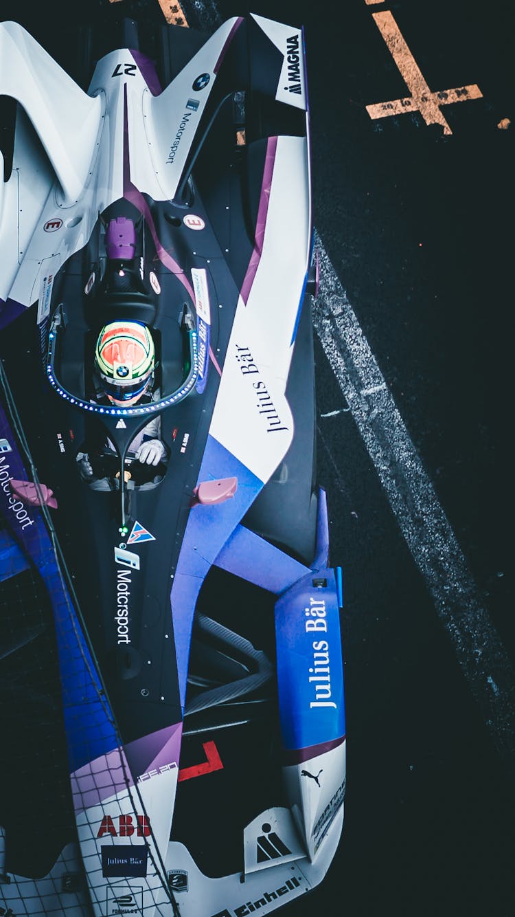 Photograph Of A Colorful Formula E Racing Car Similar To A Formula 1 Car Racing On A Track In Mexico City