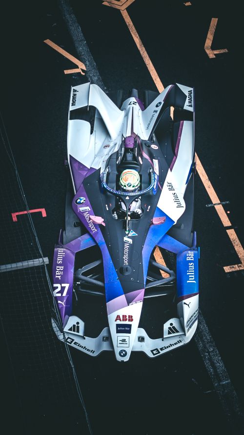 Free Dynamic shot of a Formula E race car on track in Ciudad de México, capturing speed and precision. Stock Photo