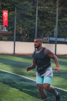 Man exercises on a sunny day, showcasing fitness and sportsmanship.