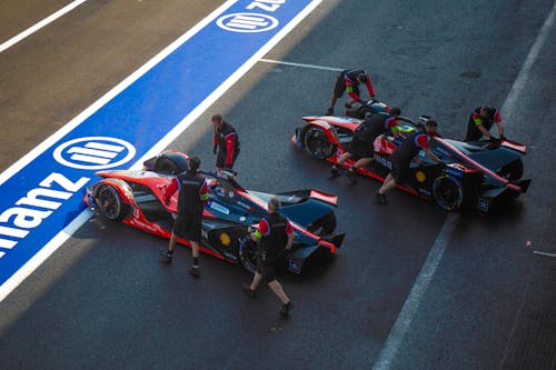 Pit Crew Pushing a Sports Car