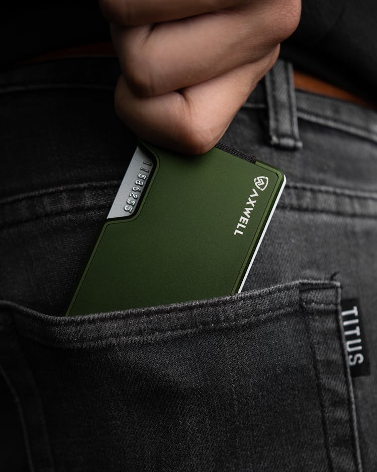 Close-Up Shot Of A Person Holding A Metal Wallet