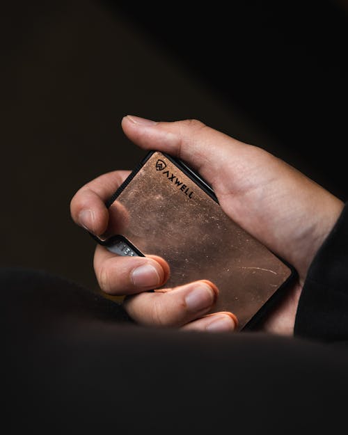 Free Man Hand Holding Wallet for Cards Stock Photo