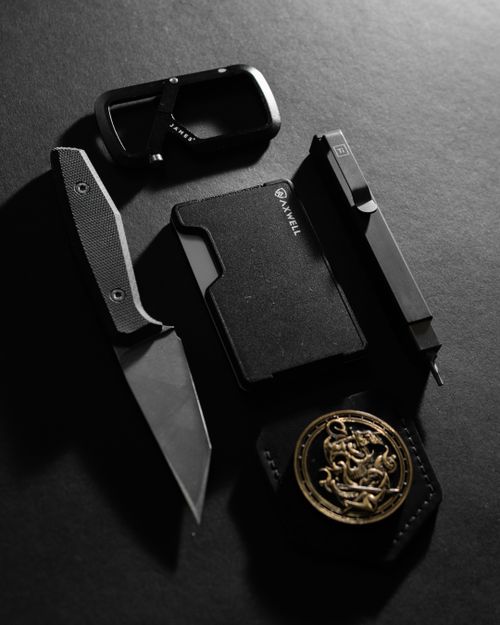 Free Close-up of pocket knife, wallet, and accessories on a dark backdrop. Perfect for EDC enthusiasts. Stock Photo