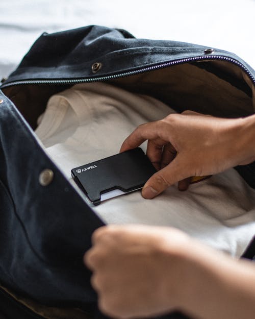 Man Hands Holding Wallet for Cards in Jacket