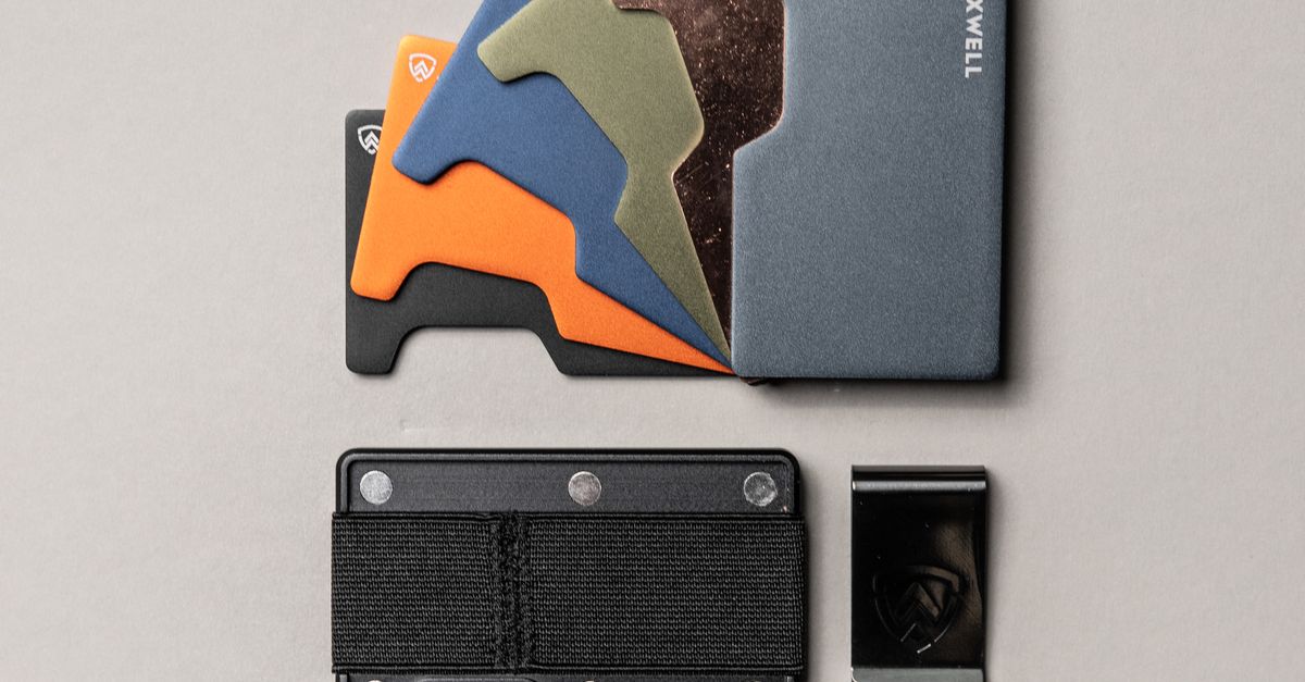 Metasl Wallet A Collection of Metal Wallets Lying on White Surface · Free Stock Photo