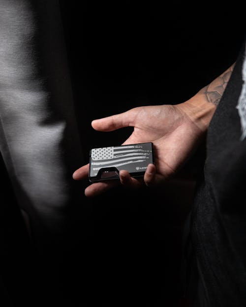 Close-Up Shot of a Person Holding an Edc Wallet