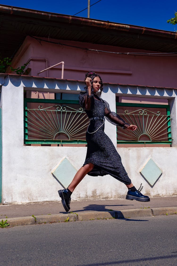 A Woman Walking In A City