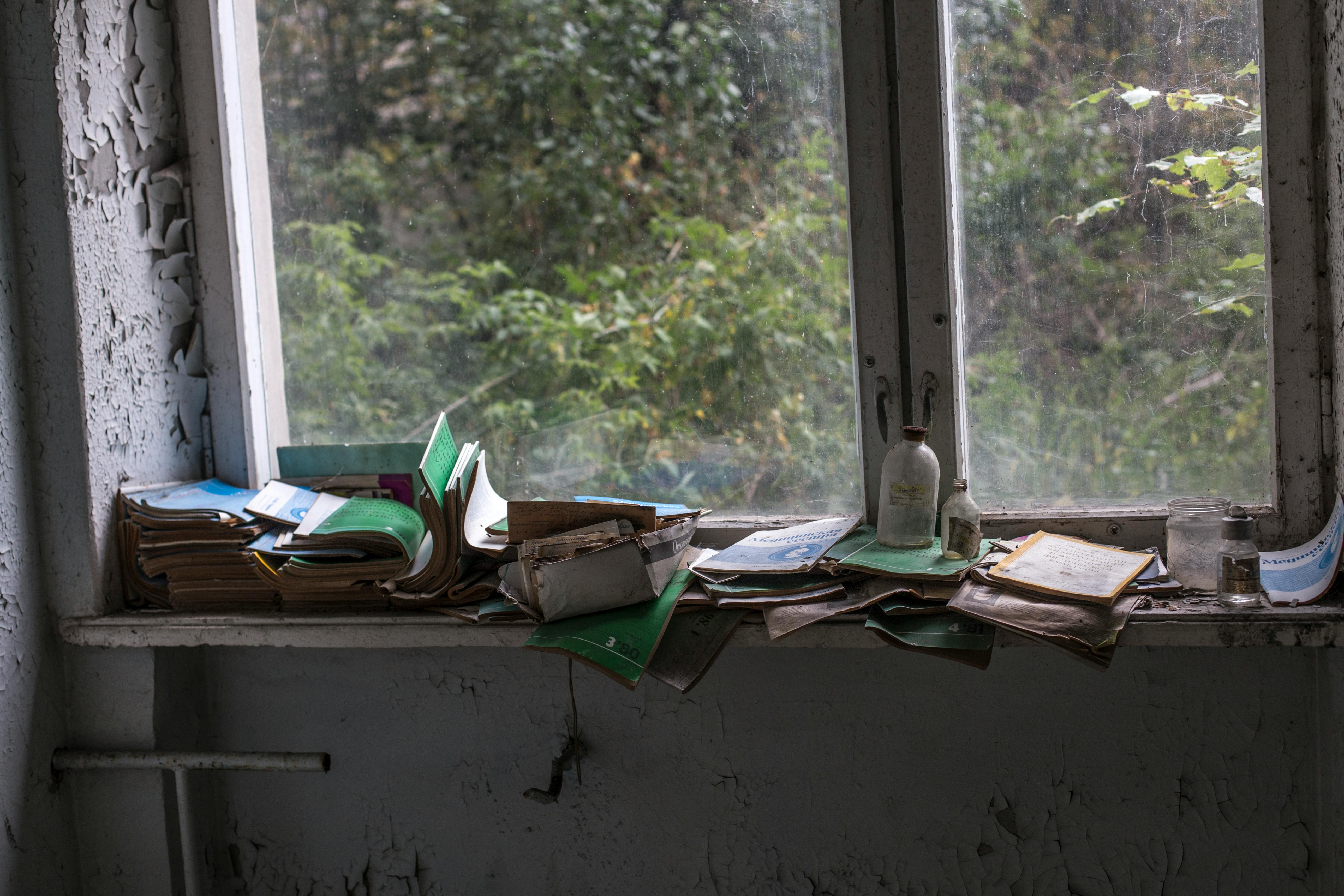 Pile of Books Beside Sash Window