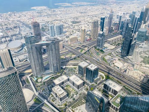 Free Stunning aerial view of Dubai showcasing its iconic skyscrapers and modern cityscape. Stock Photo