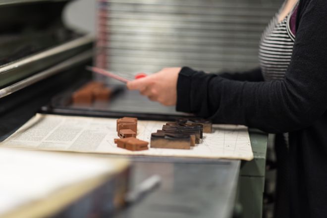 A printer arranging type blocks at a press — photo by Wendelin Jacober on Pexels