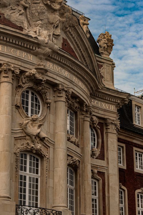 Free Intricate baroque architecture of Erbdrostenhof in Münster, showcasing detailed carvings and sculptures. Stock Photo