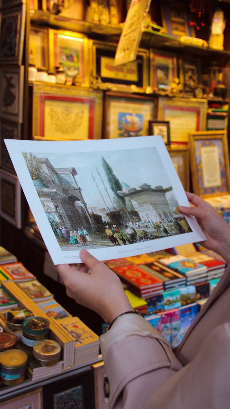 Person Holding A Picture I A Store