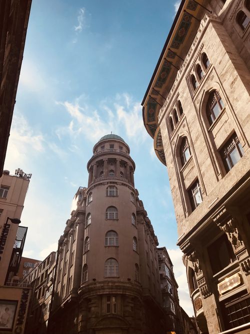 Free A low-angle view of historic buildings in Istanbul under a bright blue sky. Stock Photo