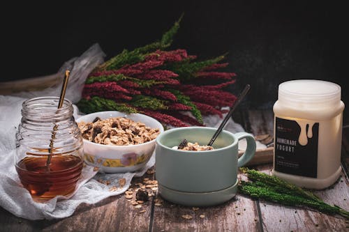 Free Honey, Yogurt, Twigs and Breakfast Cereal Stock Photo