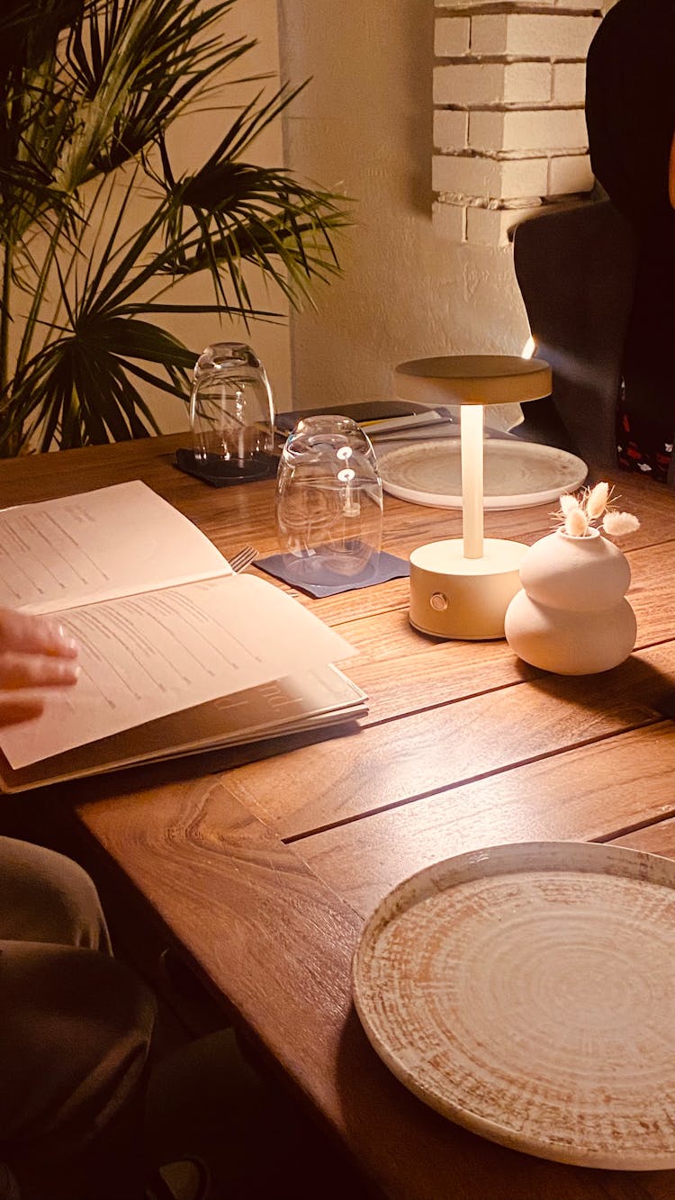 Open Book On Wooden Table