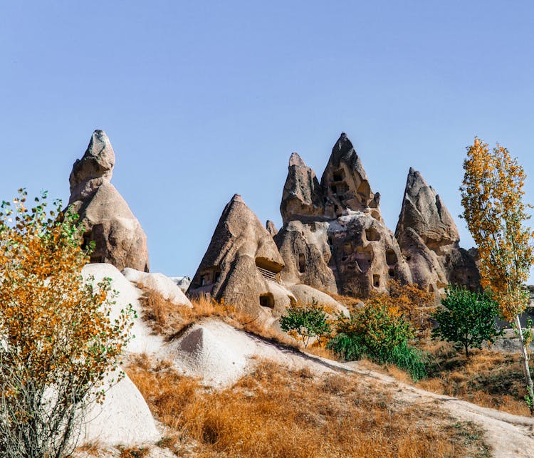 Rock Houses And Fairy Chimneys In Goreme, Cappadocia, Turkey