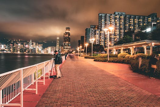 Explore the illuminated Hong Kong skyline from the vibrant Hung Hom Promenade at night.