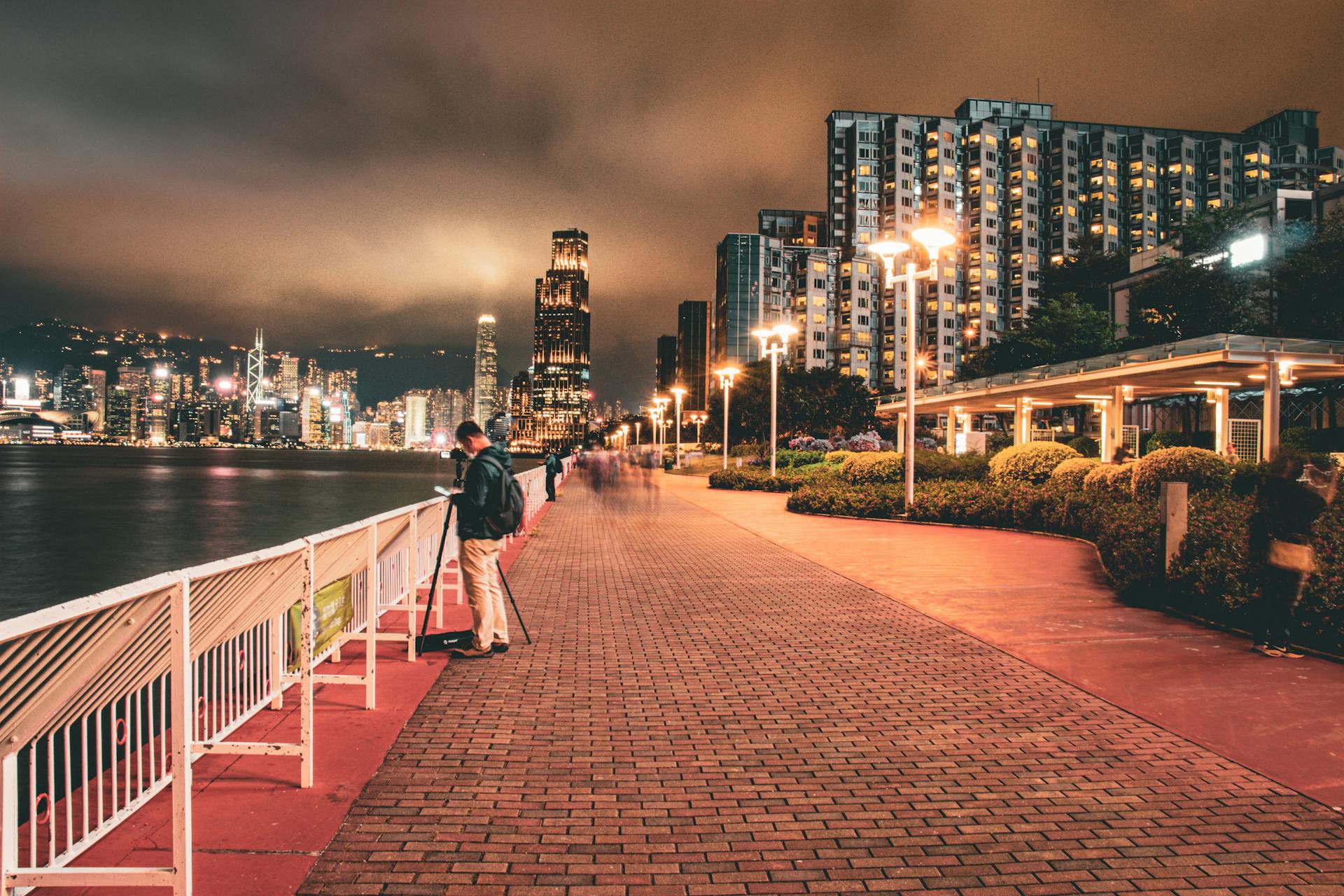 Explore the illuminated Hong Kong skyline from the vibrant Hung Hom Promenade at night.