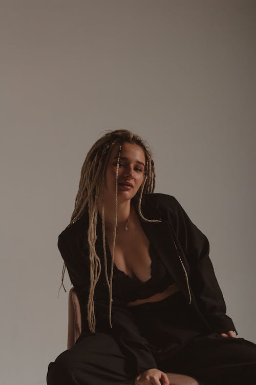 A Woman in Black Bralette and Black Blazer 