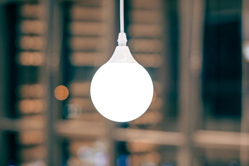 Hanging Light Bulb in Close-up Photography