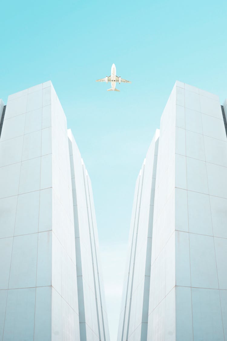 Plane Flying Above Skyscrapers