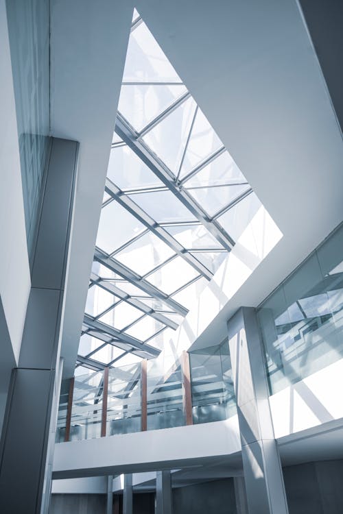 Glass Ceiling of White Concrete Building