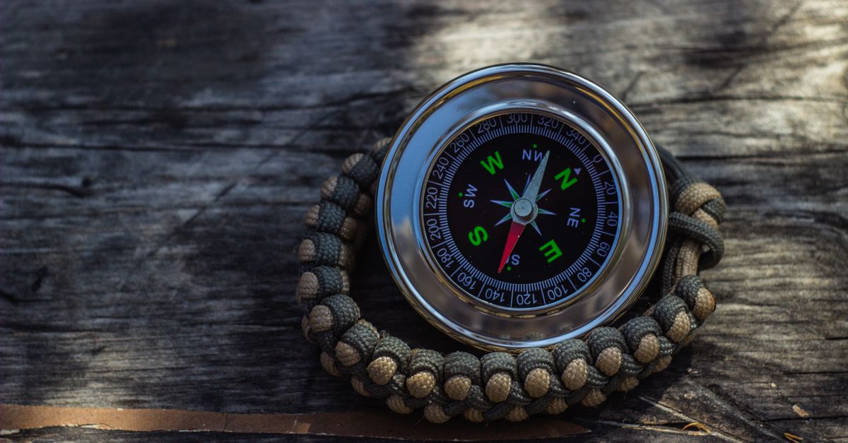 Silver and Black Round Compass on a Thread Bracelet · Free Stock Photo