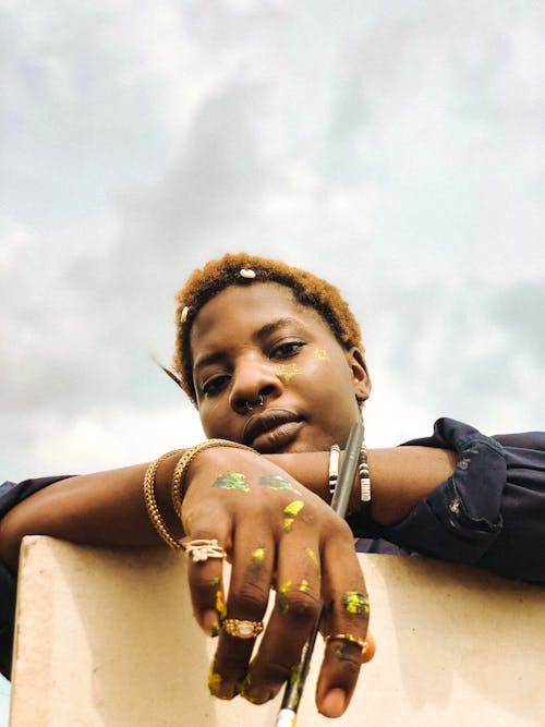 Woman with Jewelry against Sky Background