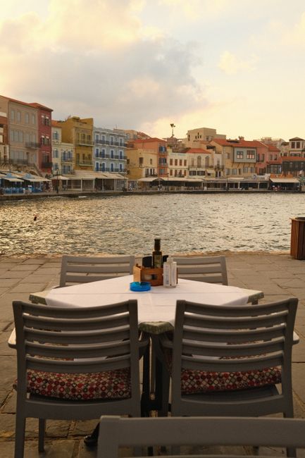 Discover a tranquil seaside dining setting with Mediterranean charm, ideal for summer vacations.